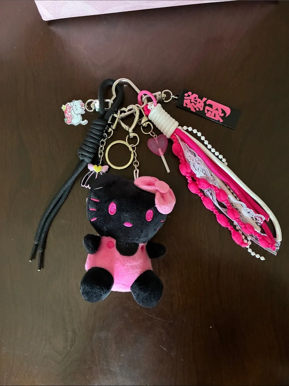 Black & Pink Plush Hello Kitty Keychain with Decorative Straps and Charms